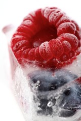 Raspberry and blueberry in ice