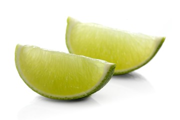 Limes on white background - close-up