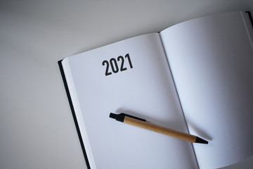Calendar 2021 and pen on white background