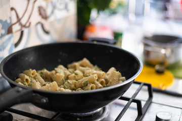 Preparing Delicious Pasta with Broccoli in a Sunlit Kitchen in Rome