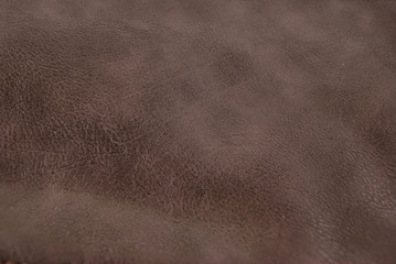 Brown leather background. Brown furniture details.