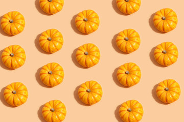 decorative pumpkins on a beige background. View from above