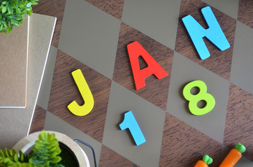 January 18, Birthday for kids with wooden text design for background.