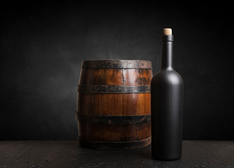 Wine tasting experience in the rustic cellar and wine bar: red wine glass and collection of excellent wines on the background