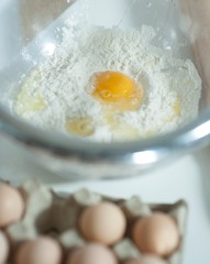 Close-up of raw egg and flour