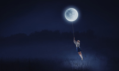 Fototapeta na wymiar Kid girl catching moon. Mixed media