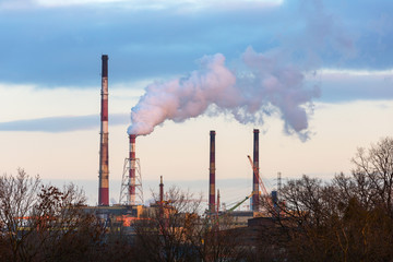 Chimneys of heating plant in Gdansk at dawn, Poland