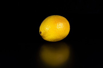 Lemon fruit on a black background