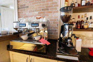 Coffee maker and espresso machine at restaurant counter