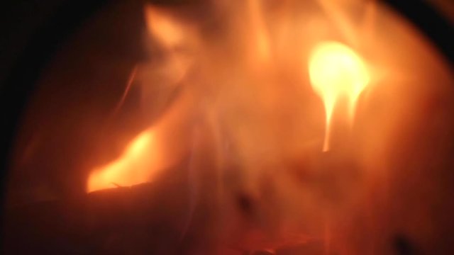 Flames Behind Smoky Glass