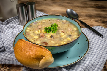 Traditional polish soup Zurek in ceramic bowl.