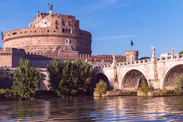Fototapeta premium Rome, Italy - October 9, 2019 - view of the sculptures of angels and the castle of the Holy Angel on a background of blue sky.