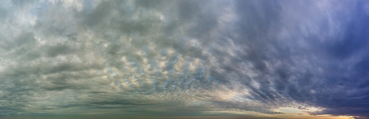 Fantastic dark thunderclouds at sunrise