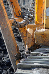 View of one part of a large bulldozer.