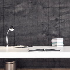 Minimalistic office desk with books on table.