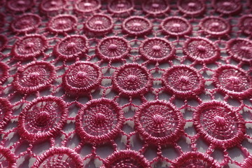 Close shot of vibrant pink lacy fabric