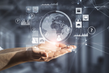 Hand holding global network interface.