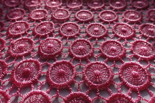 Close shot of vibrant pink lacy fabric