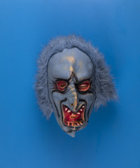 scary blue mask isolated on blue background