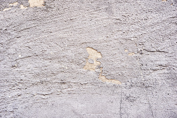 Background texture of asphalt. Hard old painted wall in grunge style. Grey surface for design and text. Close up view