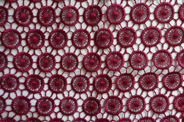 Top view of dark red lacy fabric
