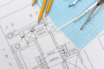 Technical drawing with millimeter paper and drawing tools. Mathematics and engineering