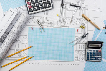 Technical drawing, graph paper and tools. Engineer  office team working with blueprints