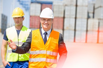 Male workers walking in shipping yard