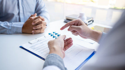 Doctor giving medical consultation diagnostic,Medical physician working in hospital, Healthcare concept.