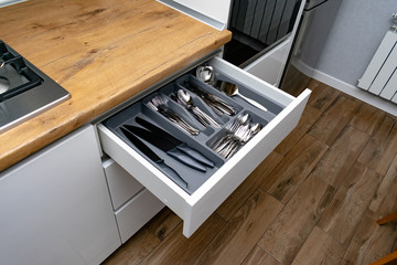 Stainless steel cutlery set in drawer