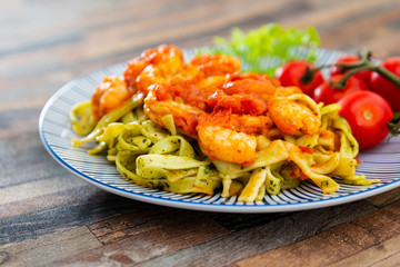 Small Gambas, stewed tomatoes, Tagliatelle with pesto