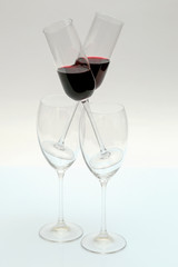 glasses with red wine on a light background