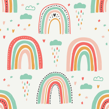Cute scandinavian childish seamless pattern with trendy hand drawn rainbows