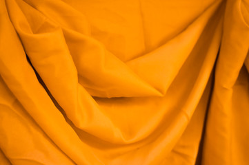 Shine Golden yellow pearl fabric silk or satin luxury cloth texture. Smooth elegant chiffon...