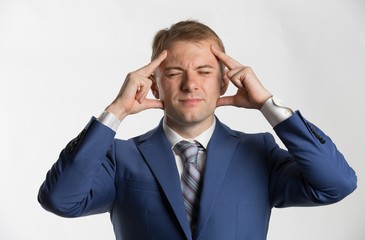 Businessman suffering from headache 