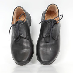 black classic shoes on white background