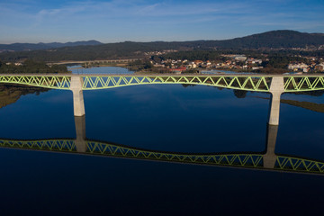 railway bridge over the river beautiful landscape shot from a drone