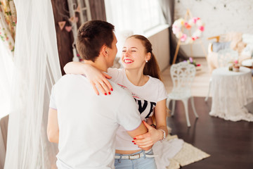a couple in love jumping on the bed and hugging © Ivan