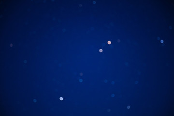 Fototapeta premium Milky way stars on a dark night sky. Blurred, out of focus image.