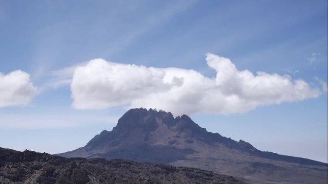 Fast moving clouds over the Mawenzi Peak in the Kilimanjaro region.