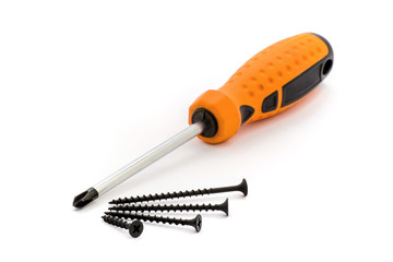 Screwdriver and screws of different sizes on a white isolated background_