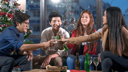 Group of friends celebrating christmas at office.