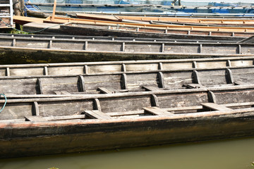 Fototapeta na wymiar Rowboat, wooden boat, moored in the reservoir