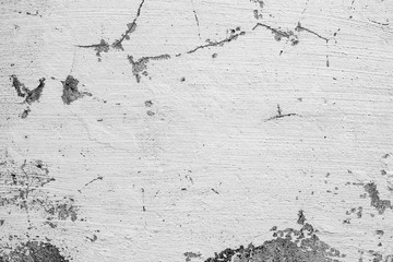 Texture of a concrete wall with cracks and scratches which can be used as a background