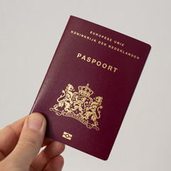Dutch passport in hand