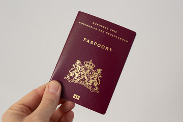 Dutch passport in hand