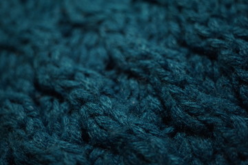 Knitted texture, dark blue thread pattern, cozy winter background.