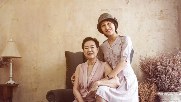Asian Wealthy Family Mother And Daughter Portrait In Beautiful House
