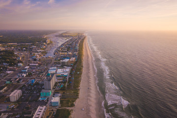 Aerial view of City, Ocean and Beach at sunrise