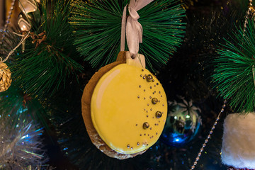 Close-up, Christmas tree decorated with toys. Christmas gingerbread decorates the holiday tree. Christmas background, holiday background. Winter, holiday, christmas.